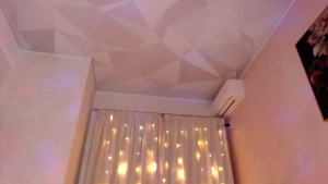 Maid doll put into it s dusting configuration Ankles chained hands cuffed caged plugged and a duster strapped to it s